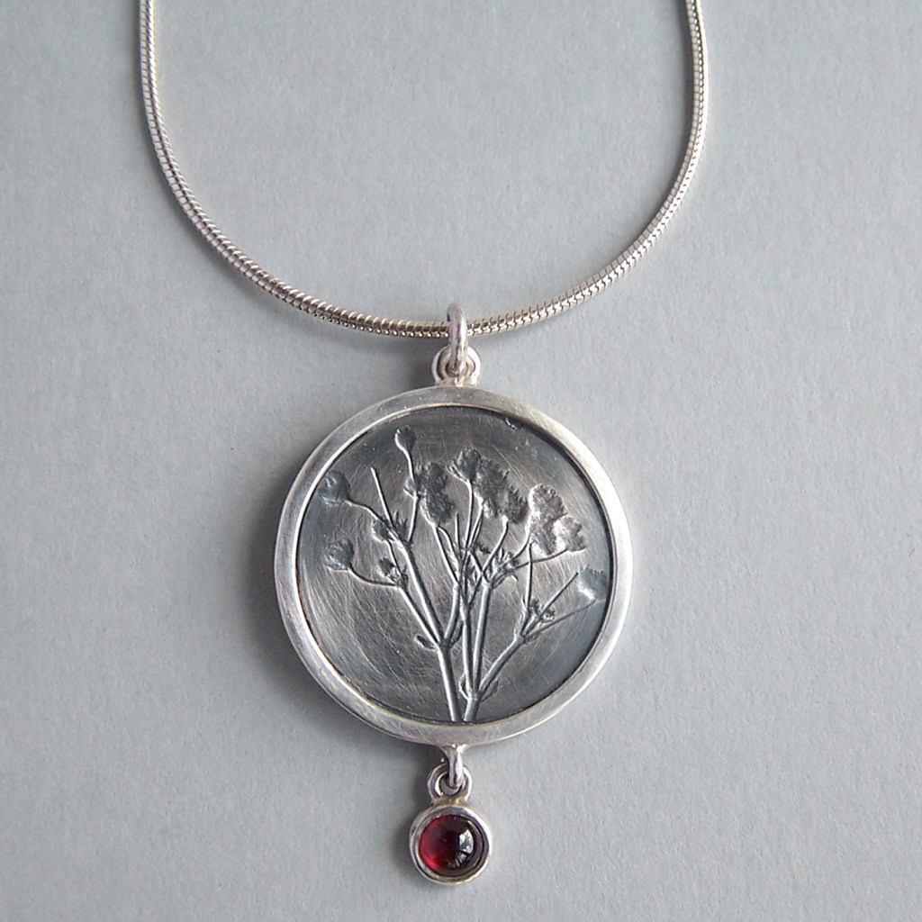 Naomi James - Round Garnet Frame Flower Pendant